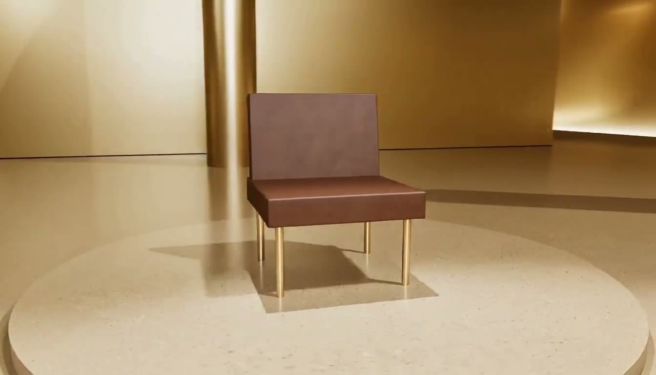 A dark chair on a round plinth in a gold gallery